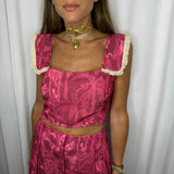 CONJUNTO TOP E SAIA ROSA