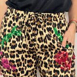 CALÇAS ANIMAL PRINT COM BORDADOS