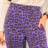 CALÇAS BAGGY ANIMAL PRINT ROXO