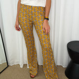 CALÇAS MALHA SEDA MOSTARDA ESTAMPADAS