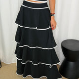 CONJUNTO TOP E SAIA PRETO FOLHOS COM VIVO