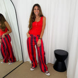 CALÇAS RISCAS VERMELHO E BERINGELA