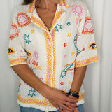 CAMISA COM BORDADOS