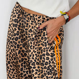 CALÇAS ANIMAL PRINT RISCAS LATERAIS