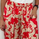 CALÇAS VERMELHAS COM LEOPARDOS